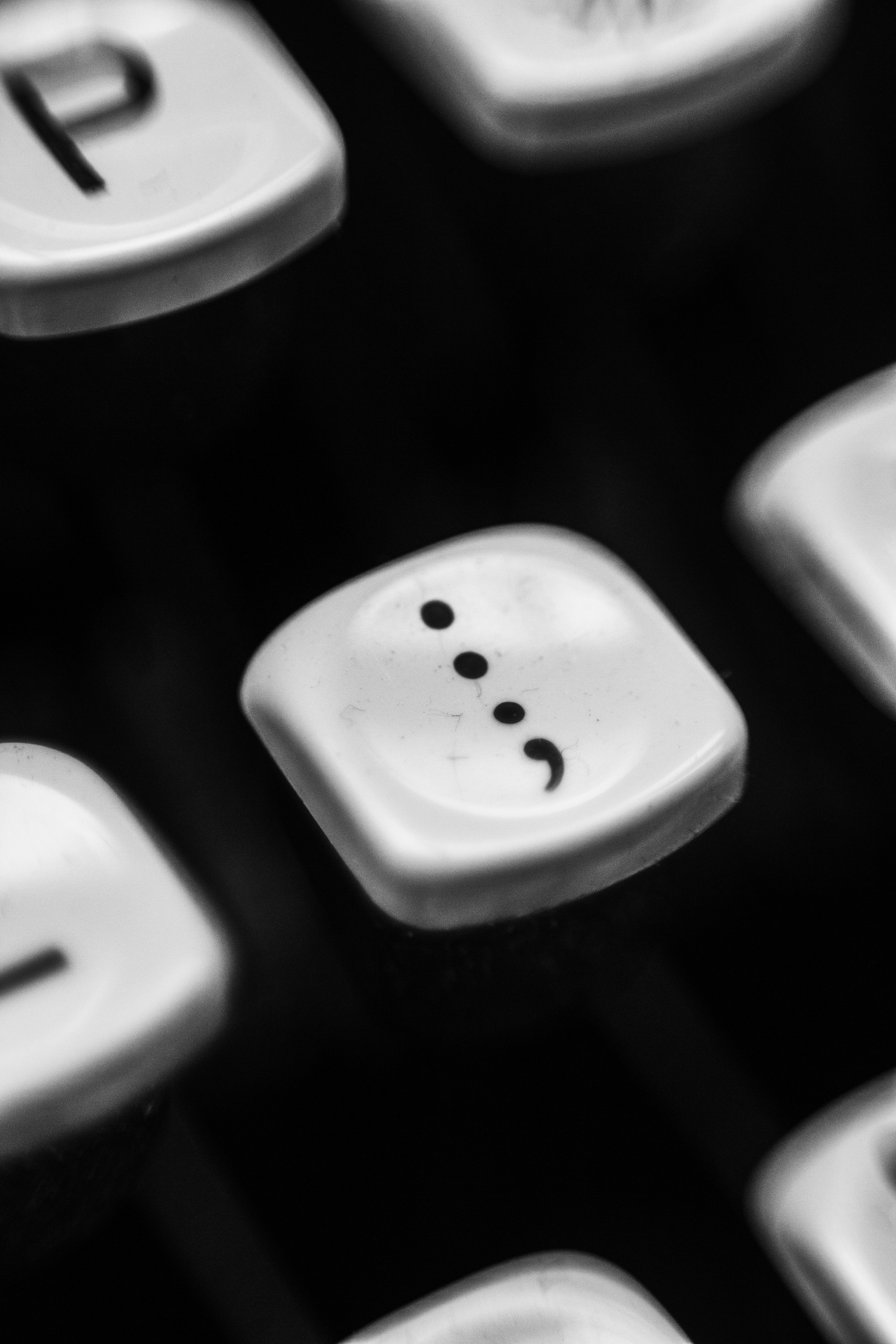 Keyboard showing the semi-colon key. 